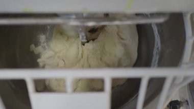 baker artisan making mixing kneading dough for holiday sweets and bread buns 4k video