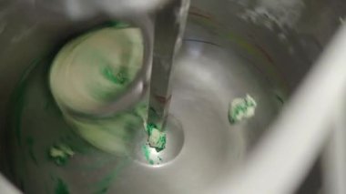 baker artisan making mixing kneading green coloured dough for holiday sweets and bread buns 4k video