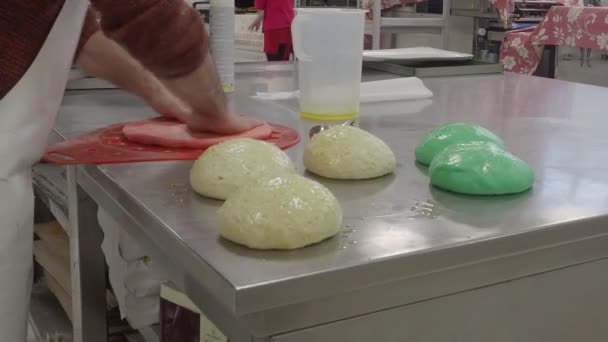 Creative Baker Kneading Massaging Smoothing Cutting Coloured Dough Bread Pizza — Stock video