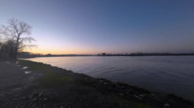 Emilia Romagna, Italy - January 2023 Sunset at Po River in Monticelli d'Ongina Piacenza Italy time lapse 4k video footage