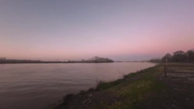 Emilia Romagna, Italy - January 2023 Sunset at Po River in Monticelli d'Ongina Piacenza Italy time lapse 4k video footage