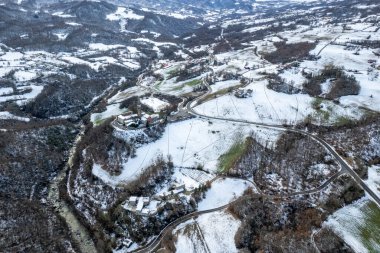 Morfasso, Piacenza, Emilia Romagna, Italy Drone view panorama of Our Lady of Lourdes Grotto - Sperongia Parish and hills a sunny day