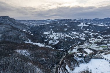 Morfasso, Piacenza, Emilia Romagna, Italy Drone view panorama of Our Lady of Lourdes Grotto - Sperongia Parish and hills a sunny day