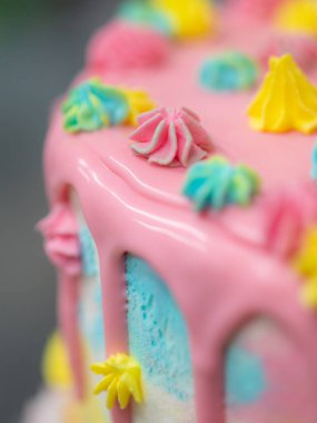 pastry chef designer making a football soccer ball as a frosted cake topper photo
