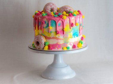 pastry chef designer making a football soccer ball as a frosted cake topper photo