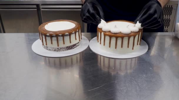 Chef Pastry Baker Preparing Salty Caramel Frosted Dripping White Cakes — Video Stock