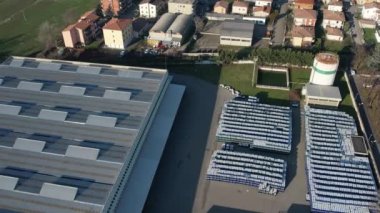 drone aerial footage scenic view flying above industrial area and factory logistics buildings in suburban zone of town.