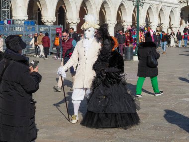 Venice, Italy - 13th february 2023 Carnival time and masked people gather in costume in Piazza San Marco area, Venezia.