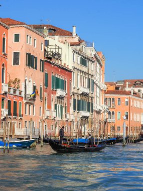 Venice, Italy - 13th february 2023 Venetian Gondolier riding rowing driving gondola with toursit as carnival busy season