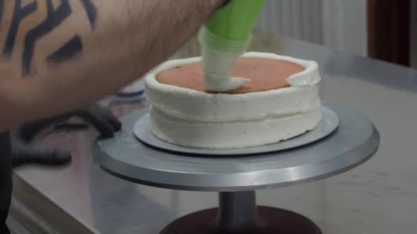Unrecognizable Pastry Chef Preparing Three Floor Frosted Cake Assembling Spongy — Stock Video