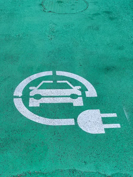 stock image Loreto, Ancona, Italy - April 2023 Charging station for electric vehicles near the walls of Basilica sign and parking space for 2 cars