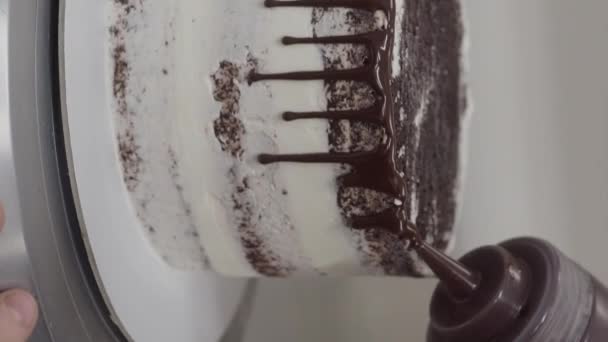 Pastry Chef Squeezing Chocolate Filling Decorating Dripping Frosted Chocolate Cake — Stock Video