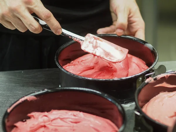 stock image chef preparing white pink red cake creamy mixtures doughs to bake in the oven