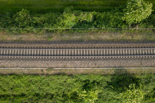 Flying over railway tracks, top view. Railway track tracks line railroad train rail aerial photo panoramic view travel