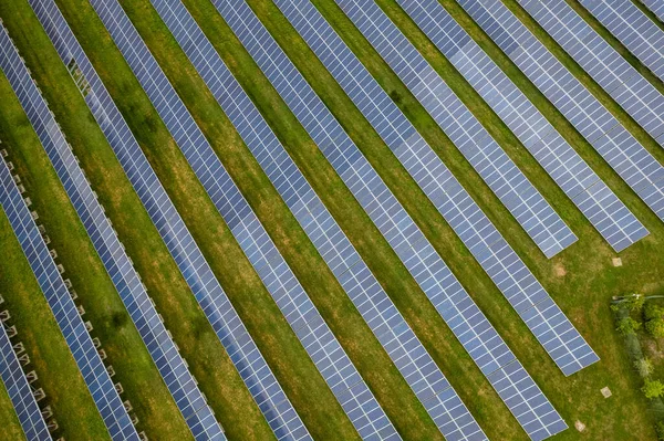 stock image Renewable energy. Aerial shot drones fly over a photovoltaic power station. Group pf solar panels looking the sun for energy production.