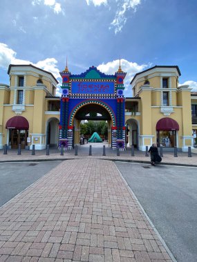 Fidenza, Italy - May 2023 Walking in artsy and colorfull Fidenza Village luxury fashion shopping mall in Emilia Romagna. clipart