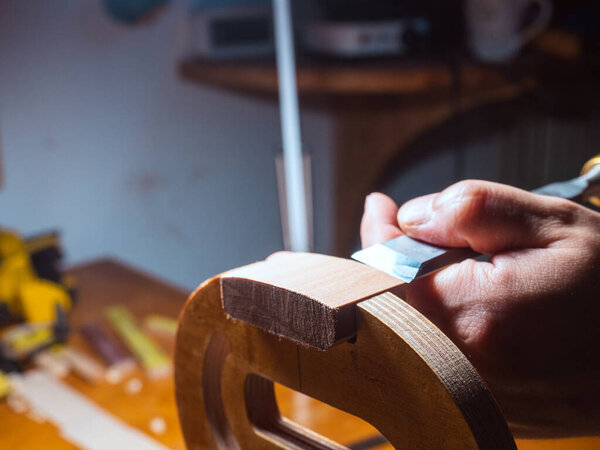 luthier violin maker luthier working with violin mould on top block, center bot, corner blocks , bend ribs for a new classic handmade violin using mold