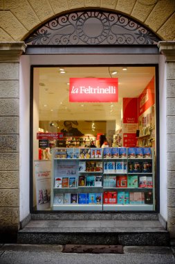 Cremona, Italy -January 15th 2024 Wide shot of la Feltrinelli bookstore window displaying books and magazines, located in Cremona, Italy clipart