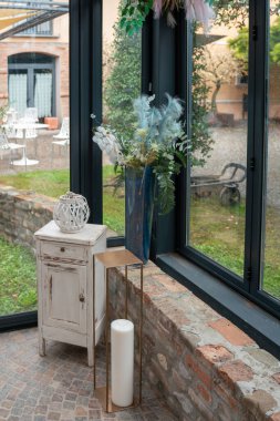 Elegant Private Event Venue Setting Prepared for a Sophisticated Lunch Gathering with Natural Light and Outdoor Garden Views