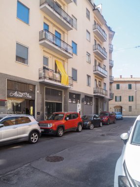 Cremona, Italy - September 18th Italian Town Street Scene with Parked Cars and Buildings Under a Bright Blue Sky Showing a Typical European Urban Environment