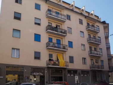 Cremona, Italy - September 18th A Captivating View of a Residential Apartment Building Facade in Lombardy Italy Featuring a Variety of Window Colors and Balconies Under a Bright Sky