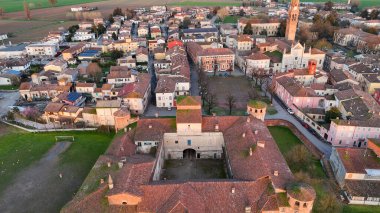 Panoramic aerial view of the historic town of Monticelli d'Ongina in the province of Piacenza Italy showcasing its ancient fortress rocca and charming medieval architecture with picturesque rooftops