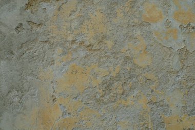 Zarif Sarı ve Gri Noktalı Yamalı Yaşlanmış Alçı Duvarın Ayrıntılı Kapalı Makro Dokuları Rustik Cazibe ve Yıpranmış Karakteri Andırıyor
