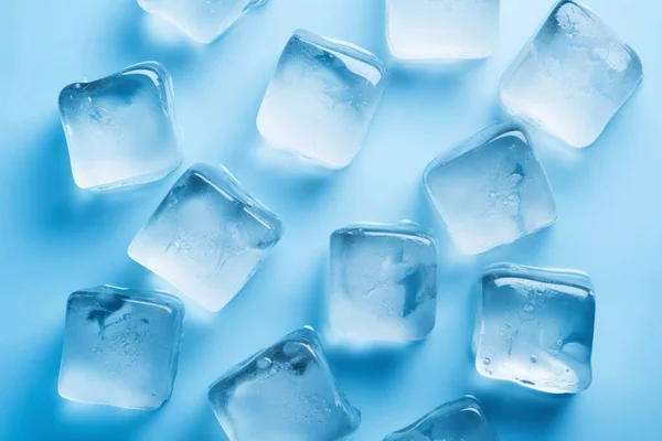 stock image Fresh ice cubes to chill drink. Frozen pure water. Clear ice cubes background. Top view of ice pieces on table. Light blue color. Macro shot