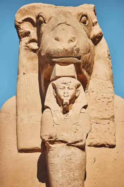 Ram Headed Sphinx. Sculpture of sphinx-ram. Statue of mythical animal and figure of pharaoh. Egypt, Luxor. Popular Egyptian landmark. Ancient Egypt. Vacation destination. Historic site. Tours and sightseeing