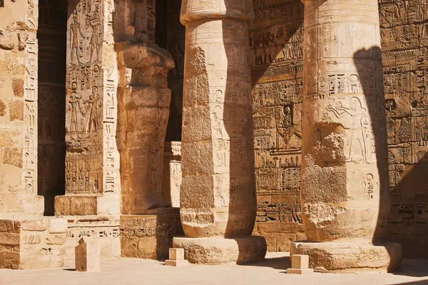 Columns with Egyptian hieroglyphs and ancient symbols. Famous Egyptian landmark. Visiting ancient Egypt. Vacation destination. Historic site. Travel attractions and heritage in Egypt