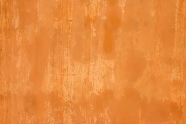 Turuncu duvar dokusu. Turuncuya boyanmış duvar grunge etkisi.