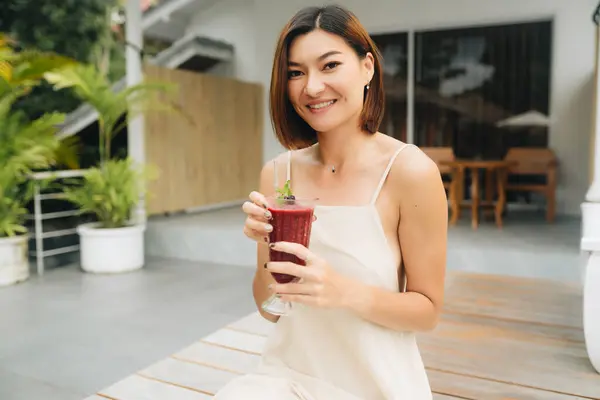 Attractive Asian Woman Beige Dress Berry Smoothie Standing Outdoors High Stock Image