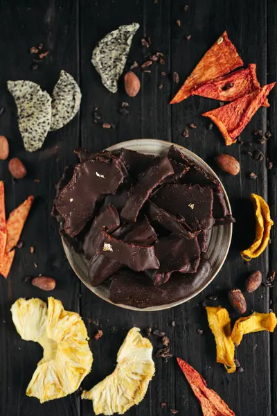 A still life of assorted dehydrated fruits in chocolate. High quality photo