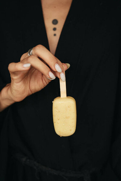 Female Hand Holding Ice Cream Eskimo Dark Background High Quality Stock Image