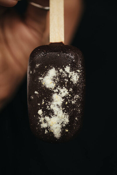 Female Hand Holding Ice Cream Eskimo Dark Background High Quality Stock Photo