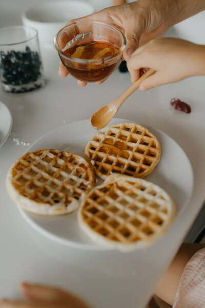 Mother and daughter preparing food in kitchen. High quality photo