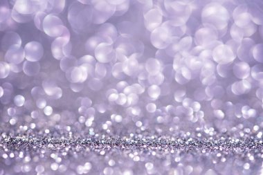 Işıltılı arka plan. Yılbaşı duvar kâğıdı telefon ışığı, ışıltı ve kış arkaplanı. Parlak, küçük, parlak bir doku. Uzayı kopyala Ürünün gösterimi için lüks tatil arka plan modeli