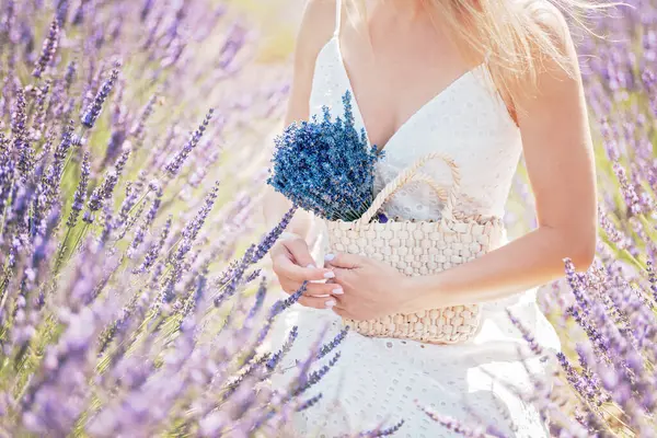 Woman White Dress Standing Holding Straw Bag Lavender Flowers Her Stock Photo