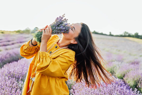 Smiling Woman Yellow Dress Holding Bouquet Lavender Flowers Standing Picturesque Stock Image