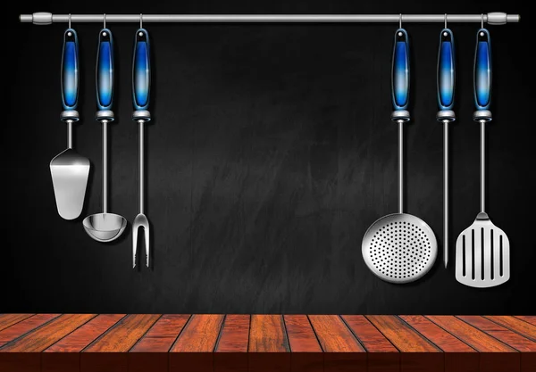 Empty wooden kitchen counter (wooden table for products display) with a set of kitchen utensils and a blackboard with copy space on background.
