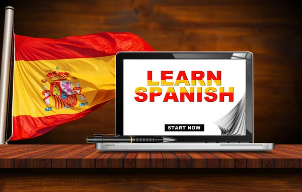 スペイン語のレッスン テキスト付きの近代的なノートPcモニターでスペイン語を学びます 背景にスペイン語のフラグを持つ木製の机の上 スペイン — ストック写真