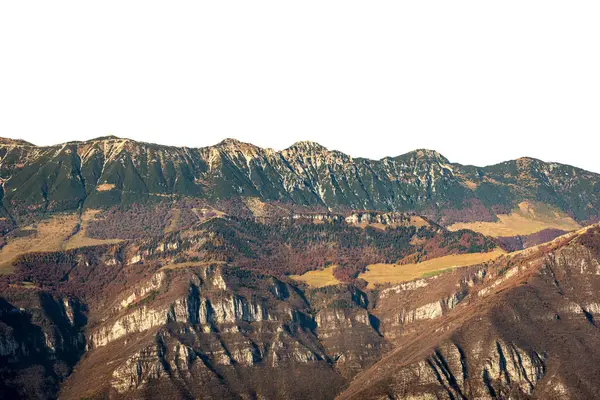 Mountain peaks of Italian Alps isolated on white background at autumn. Baldo Mountain (Monte Baldo), Mountain range between Lake Garda and Adige Valley, Italian Alps. Italy, Europe.