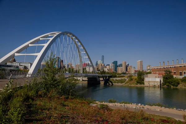 stock image Walterdale Bridge over the North Saskatchewan River. Day traffic, summer time. modern architecture, panorama of the city Edmonton, Alberta, Canada 