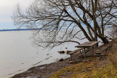 North Vancouver - mountains, bay, Cargo warehouse - industrial port, cargo ship. beautiful clouds and the sea. Travel in the summer.
