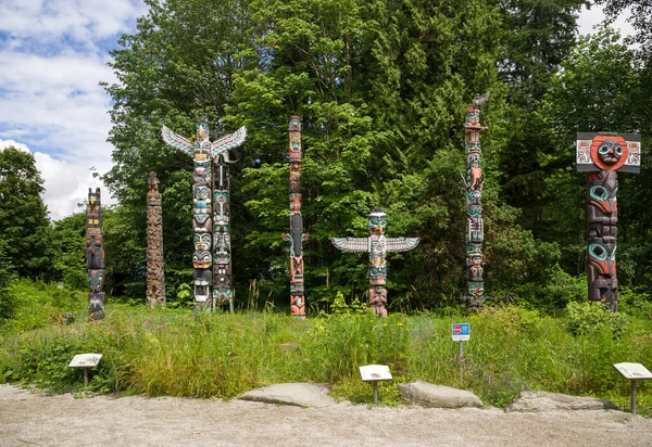 Wooden totem poles in Stanley Park. First Nations culture, travel, national art Vancouver, British Columbia, Canada