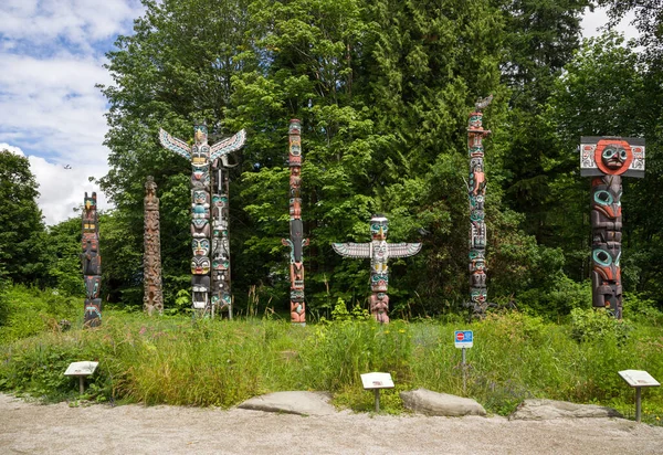 Wooden totem poles in Stanley Park. First Nations culture, travel, national art Vancouver, British Columbia, Canada