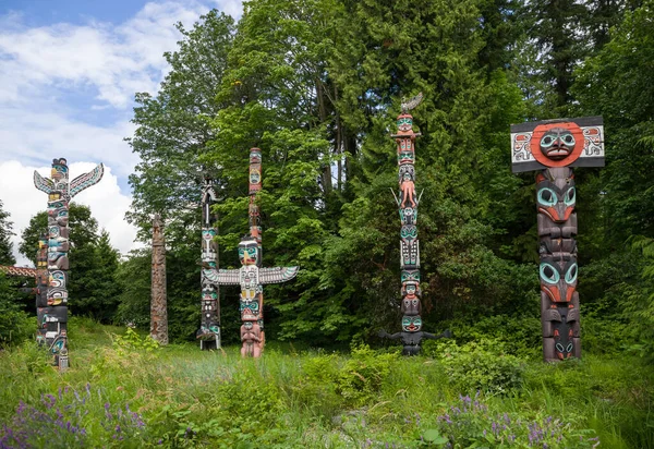Wooden totem poles in Stanley Park. First Nations culture, travel, national art Vancouver, British Columbia, Canada