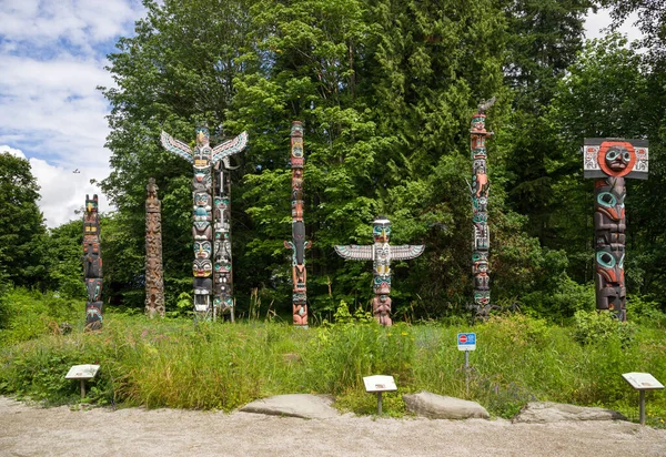 Wooden totem poles in Stanley Park. First Nations culture, travel, national art Vancouver, British Columbia, Canada