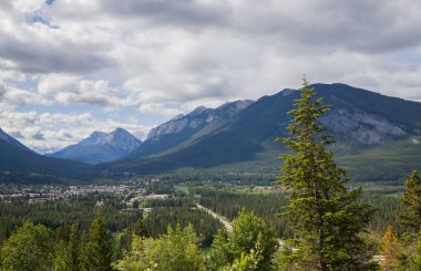 Beautiful aerial view of Rocky Mountains and river. Banff city in the valley. Alberta. Tourism - active recreation in nature