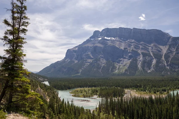 Canada landscape - Banff National Park, Alberta - summer travel to mountains, beautiful blue Bow river and coniferous forest. Bow River Valley - clear blue water, pine forest island, beautiful Rundle Mountains